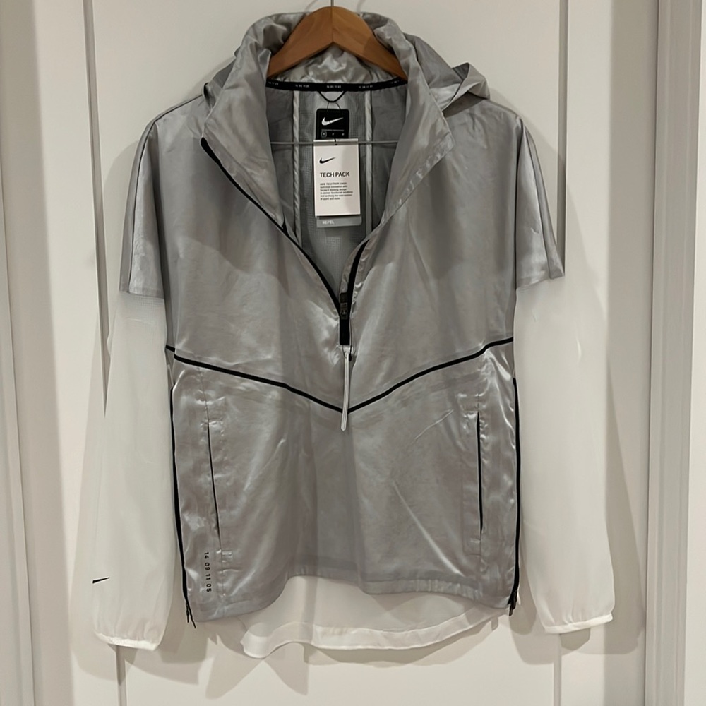 NIKE silver & white tech pack, water resistant women’s. Never worn. Brand new